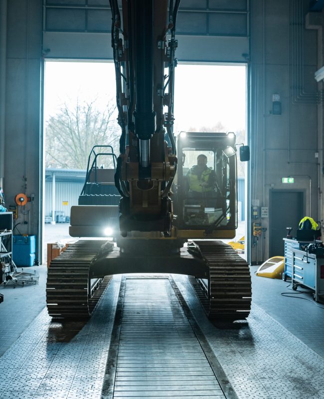 An excavator in a garage